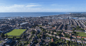Lowestoft videographer filming a aerial drone shot over the town on a summer's day