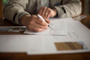 With client at desk planing their video content