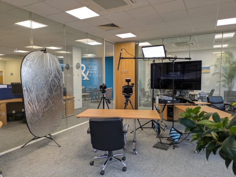 Lights, camera, boom mic negative fill filmin gset up in Norwich office