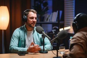 Podcast presenter being filmed in Norfolk business