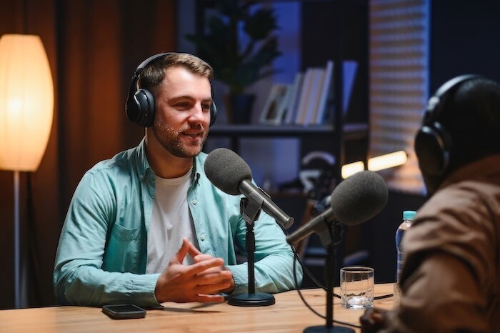 Podcast presenter being filmed in Norfolk business